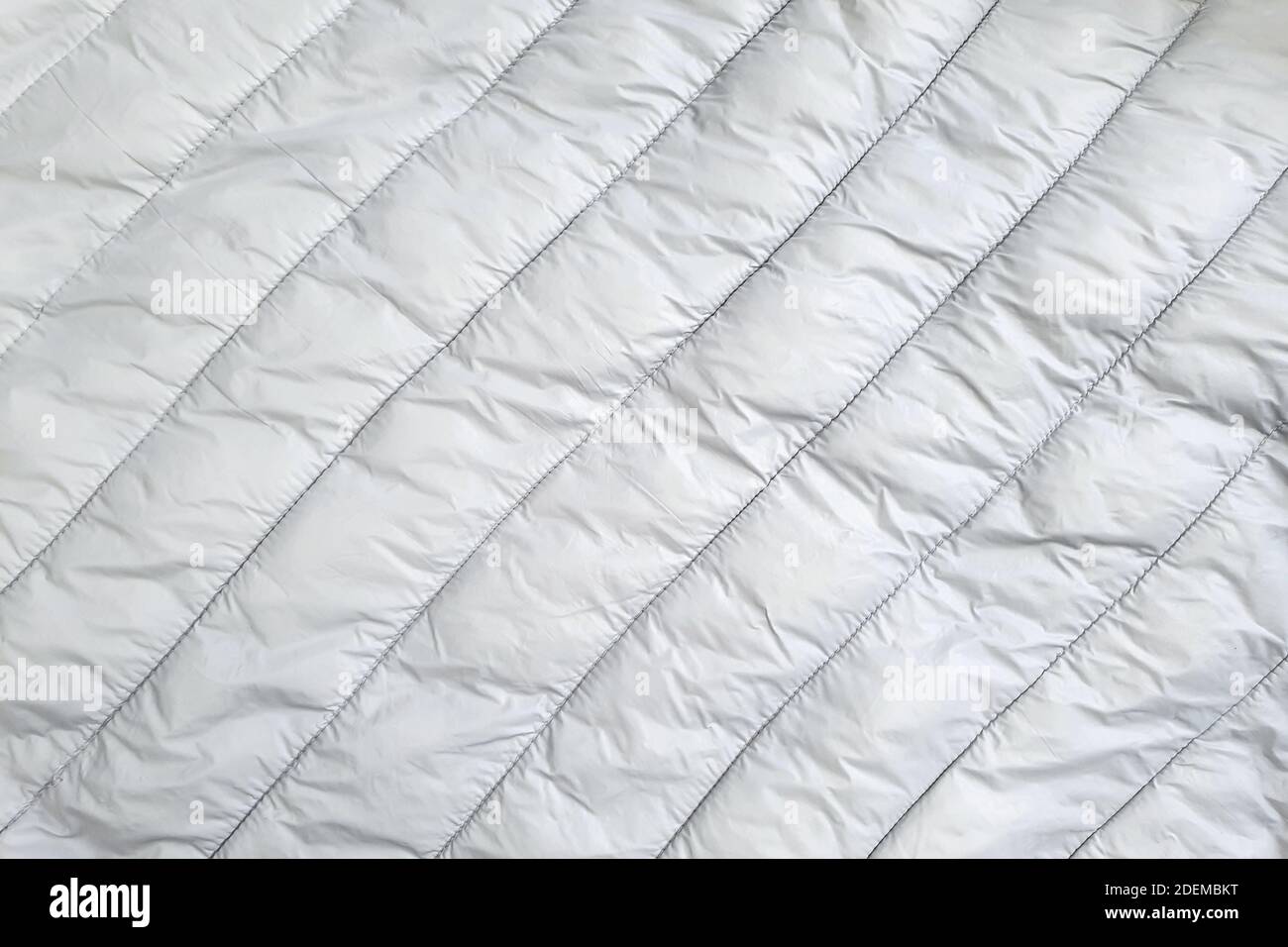 Down jacket fabric background, gray puffer jacket texture Stock Photo -  Alamy