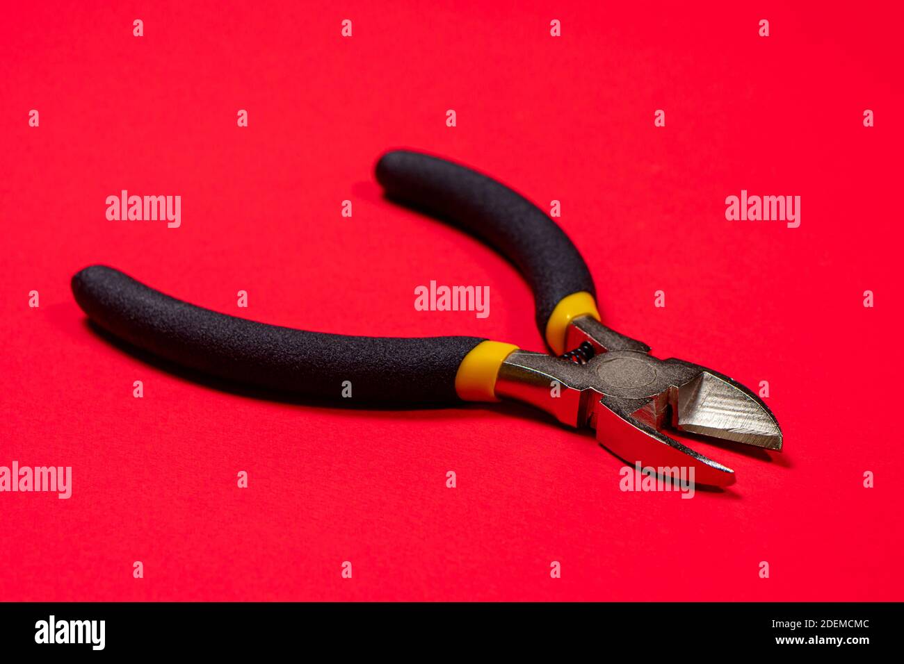 Nippers on a red background tool for cutting wires, cables and wire