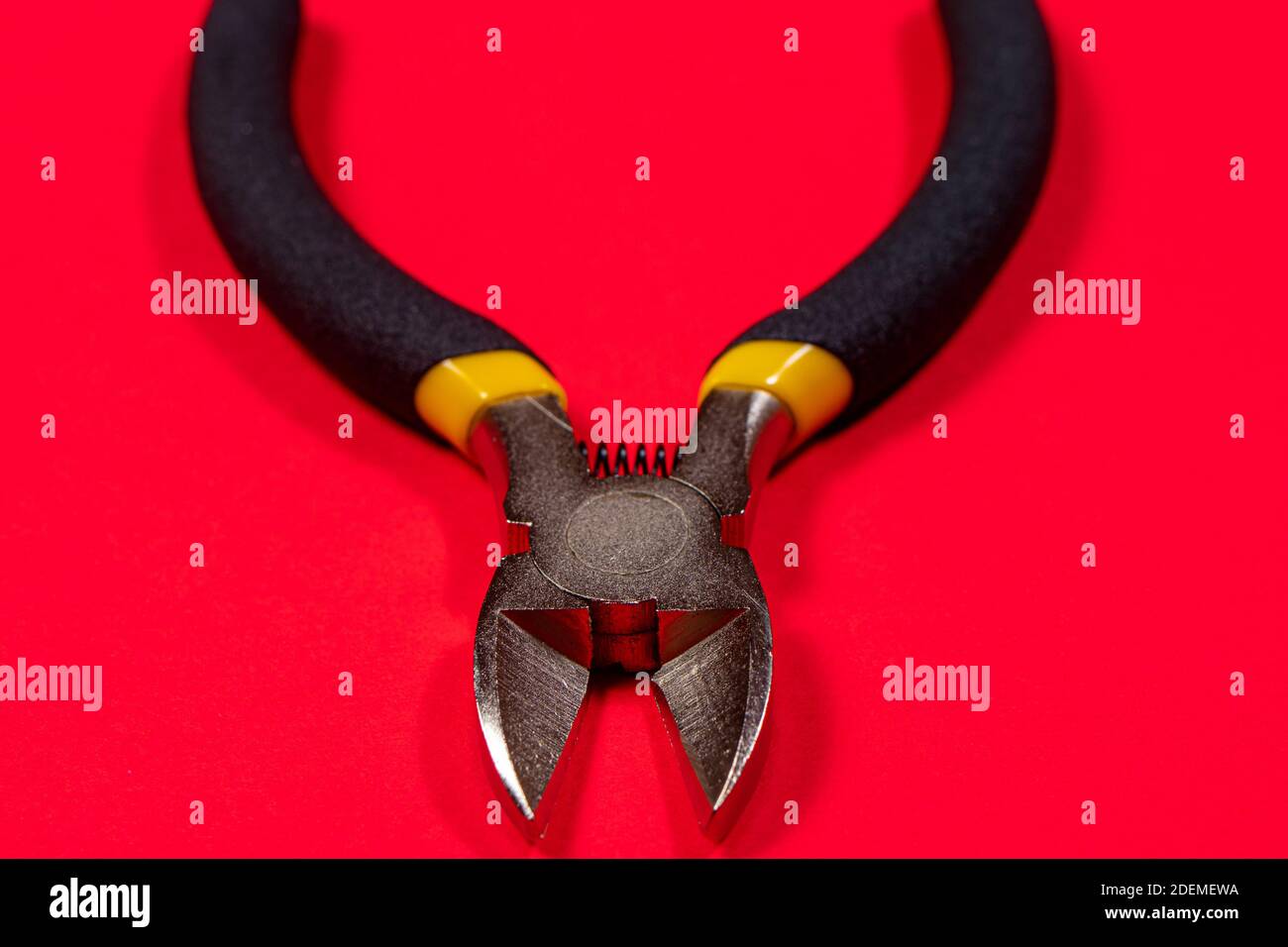 Nippers on a red background tool for cutting wires, cables and wire