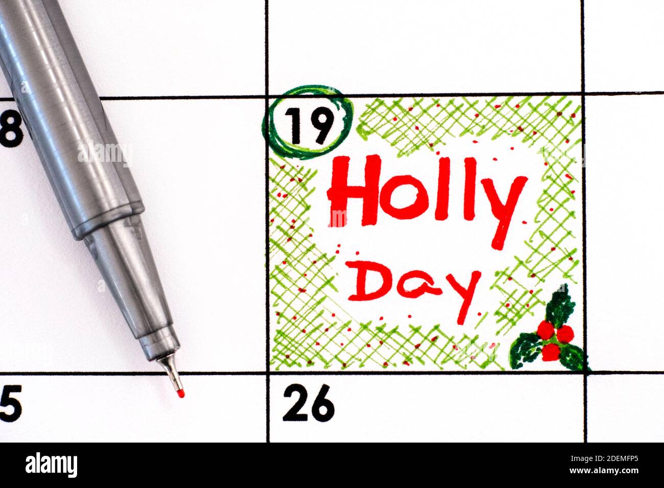 Reminder Holly Day in calendar with pen. December 19 Stock Photo Alamy