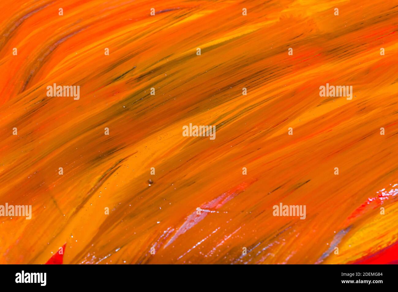 Abstract backdrop photo of red and yellow oil paint colors on canvas ...
