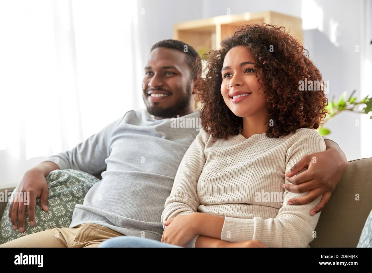 happy african american couple hugging at home Stock Photo - Alamy
