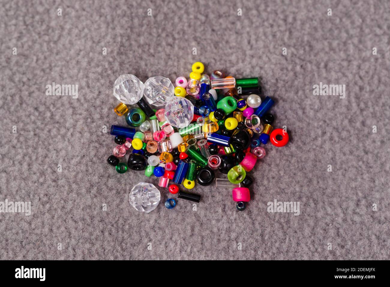 small collection of assorted beads in a small bag from a giveaway promotion Stock Photo