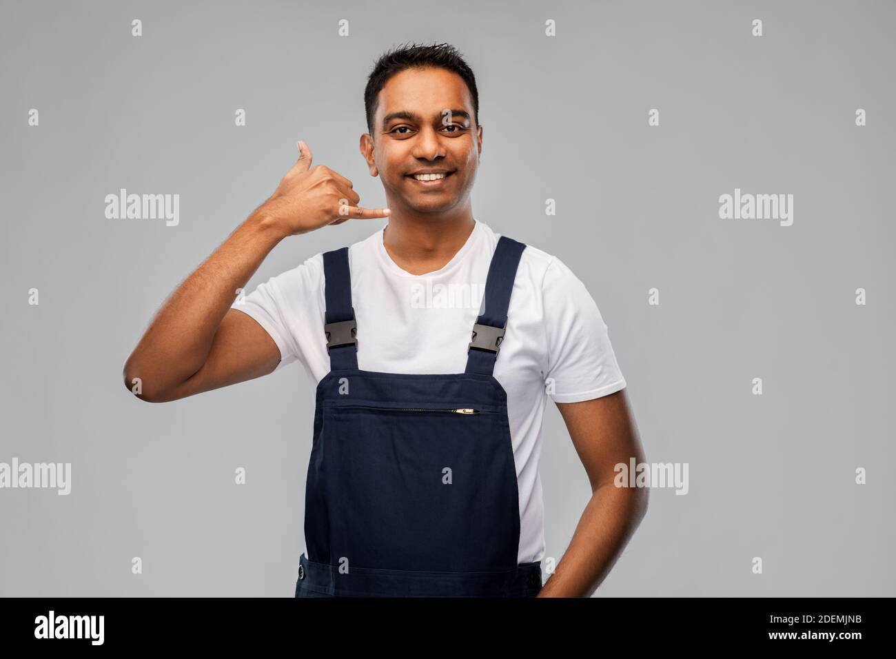 happy worker or builder making phone call gesture Stock Photo