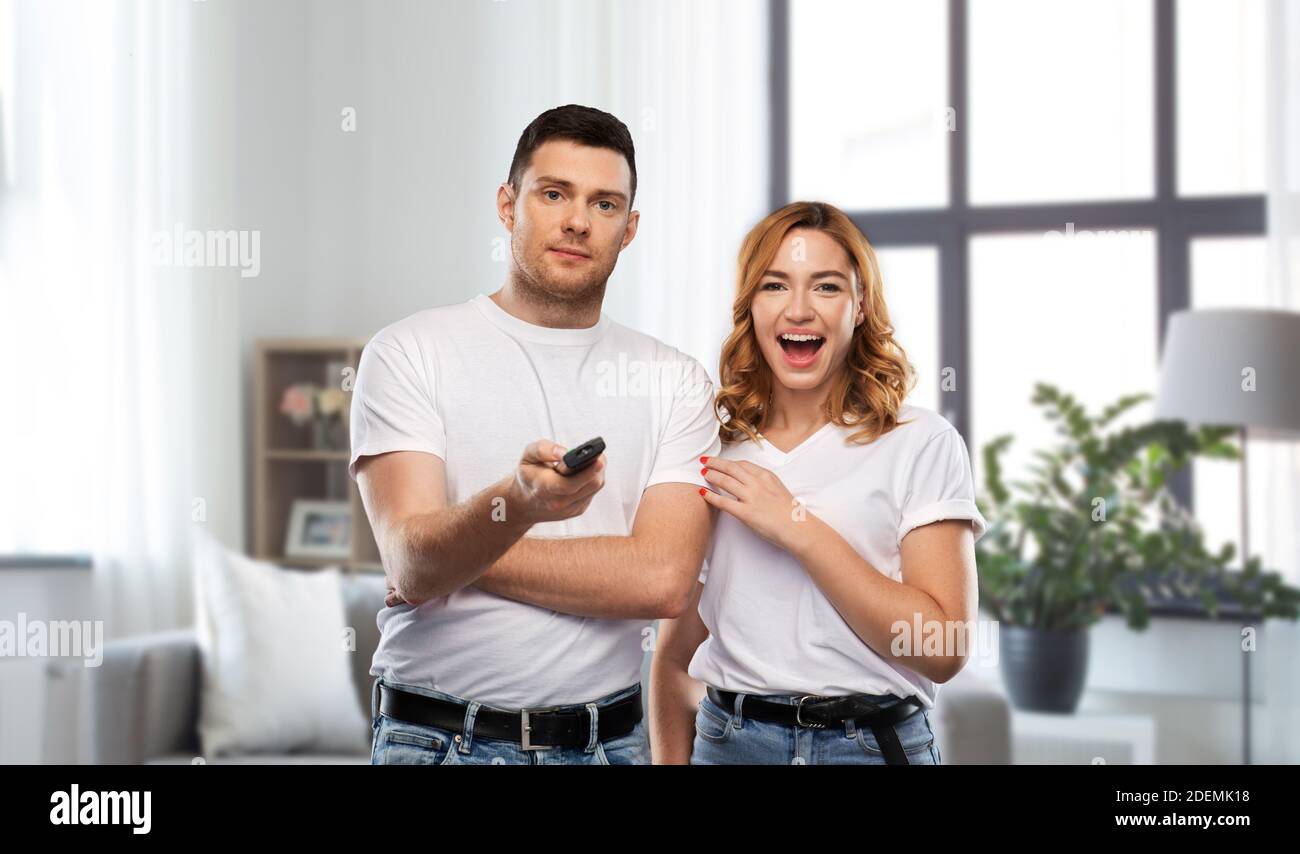 couple with tv remote control Stock Photo