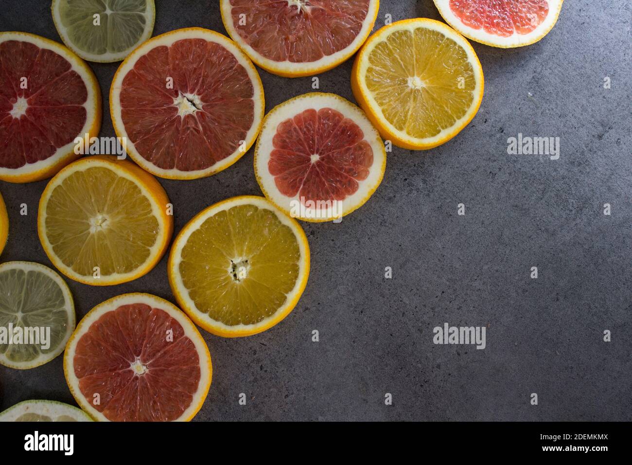 Blood orange on a table. Juicy red fruit texture close up. Gray ...