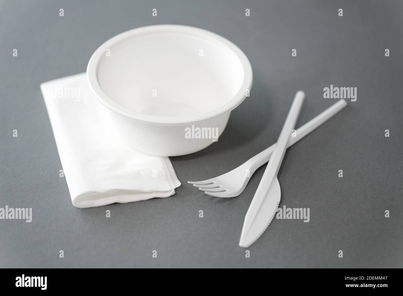 disposable plastic plate with fork and knife Stock Photo