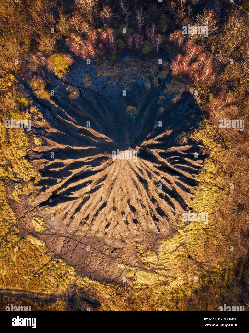 Salgótarján, Hungary - Aerial view of abandoned slag heap covered by grass, autumn landscape Stock Photo