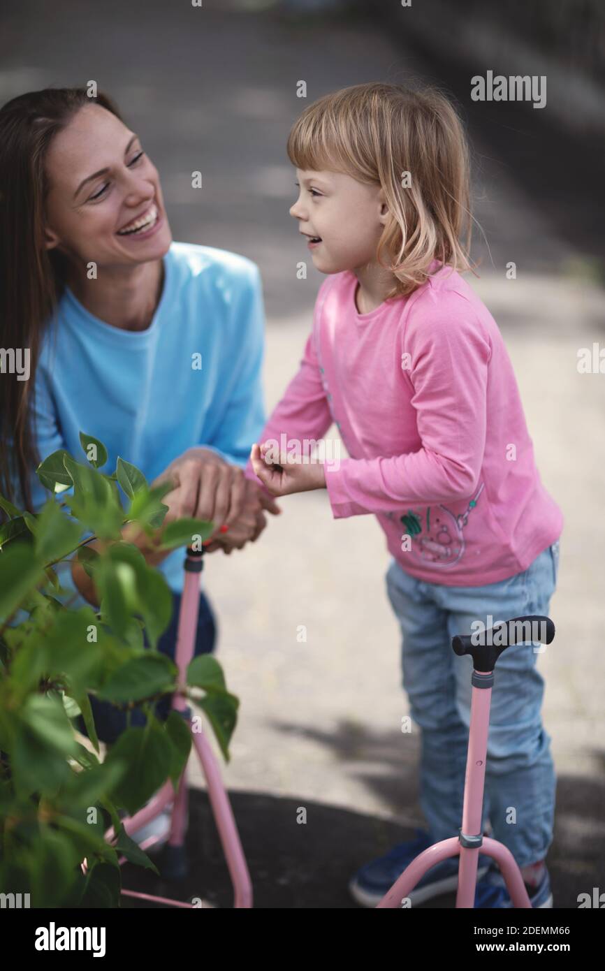 Mother and her disabled daughter Stock Photo Alamy