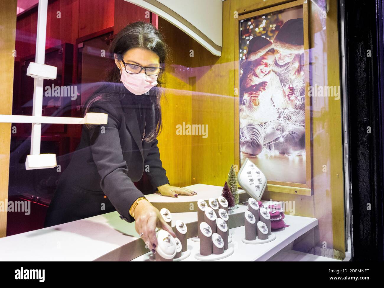 Cork City, Cork, Ireland. 01st December, 2020. Tricia Keane dressing the window display of Keanes Jewellers on Oliver Plunkett Street, Cork on their first day back after a six week lockdown due to Covid level five restrictions - Credit; David Creedon / Alamy Live News Stock Photo