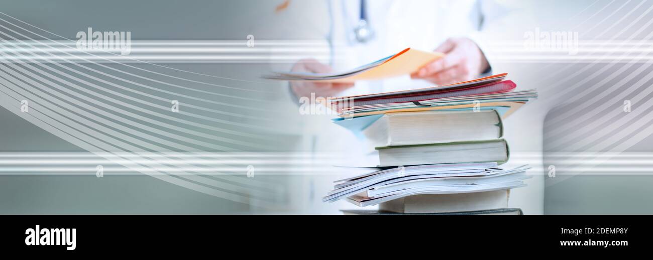Stack of medical books on a doctor's desk; panoramic banner Stock Photo ...