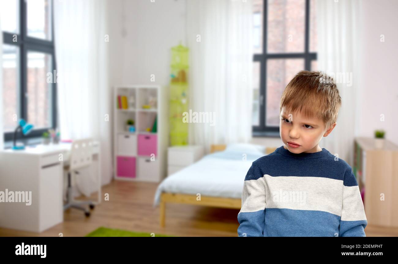 portrait of gloomy little boy at home Stock Photo