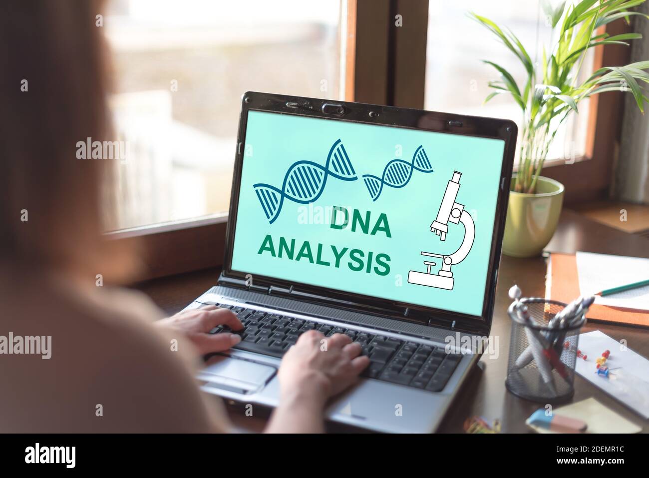 Laptop screen displaying a dna analysis concept Stock Photo - Alamy