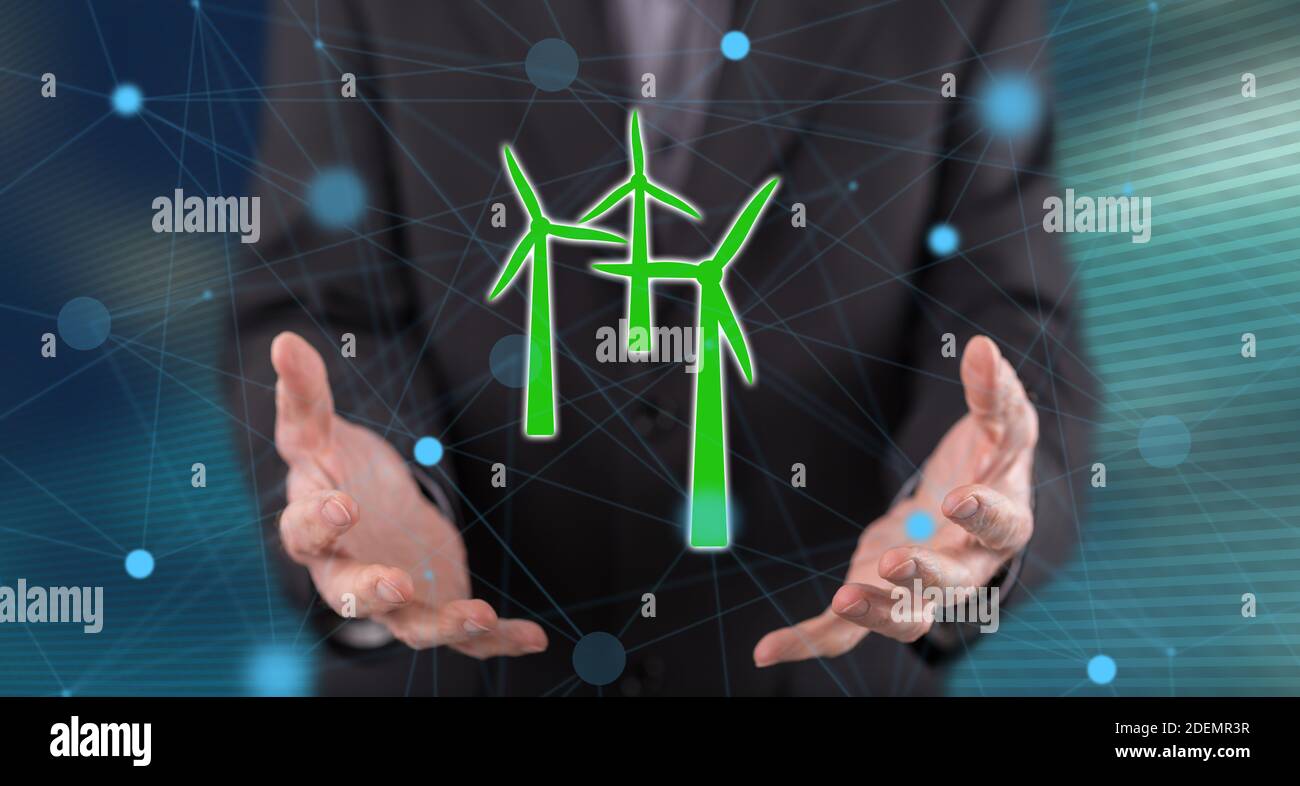 Clean energy concept above the hands of a man in background Stock Photo ...