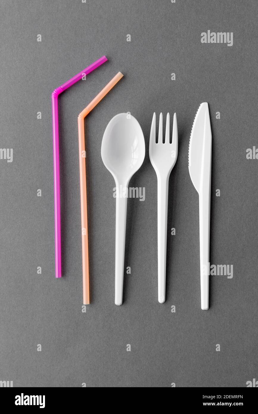 disposable plastic fork, knife, spoon and straws Stock Photo