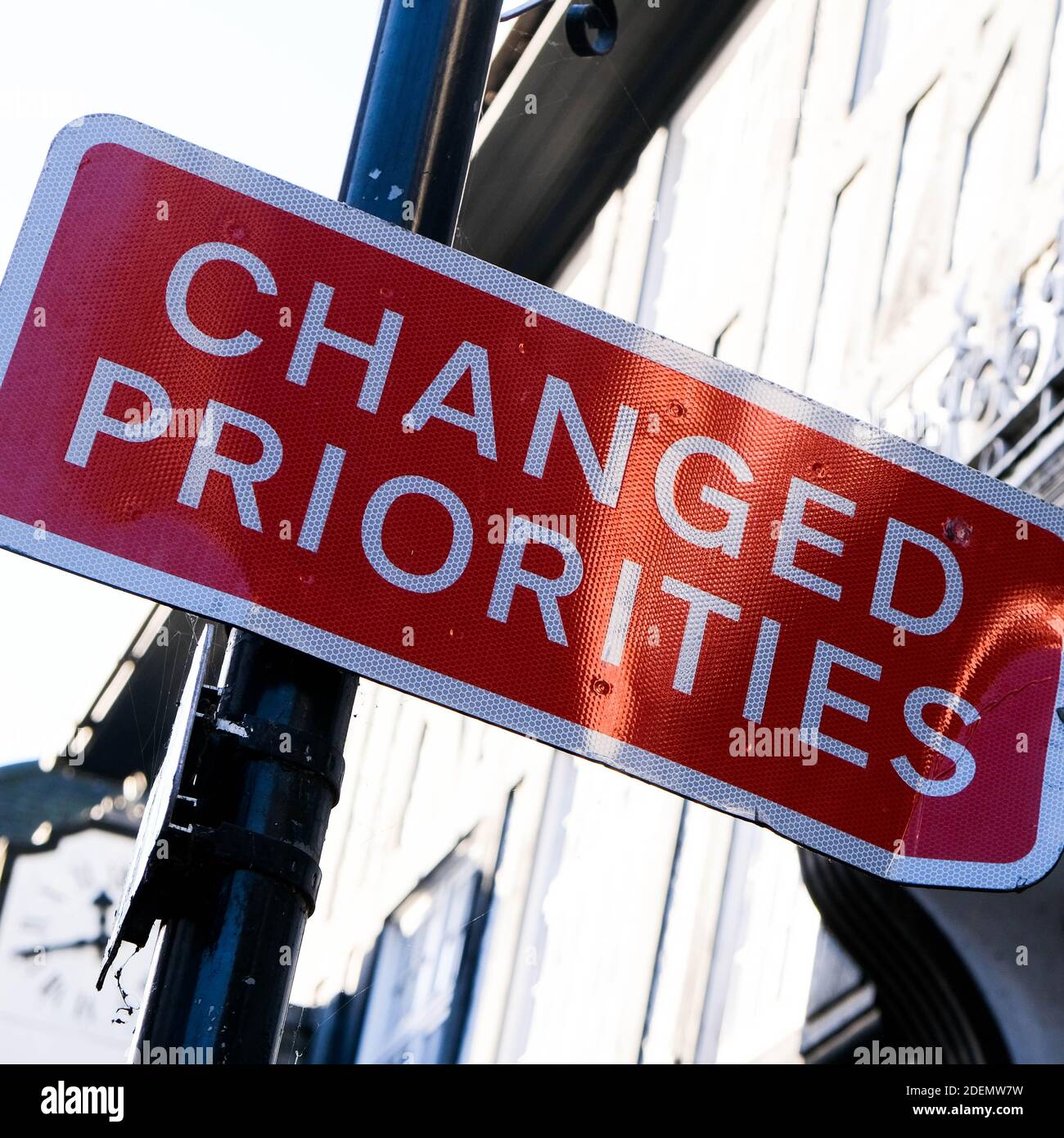 London UK, December 01 2020, Changed Priorities Warning Road Sign for Motorists And Pedestrians Stock Photo