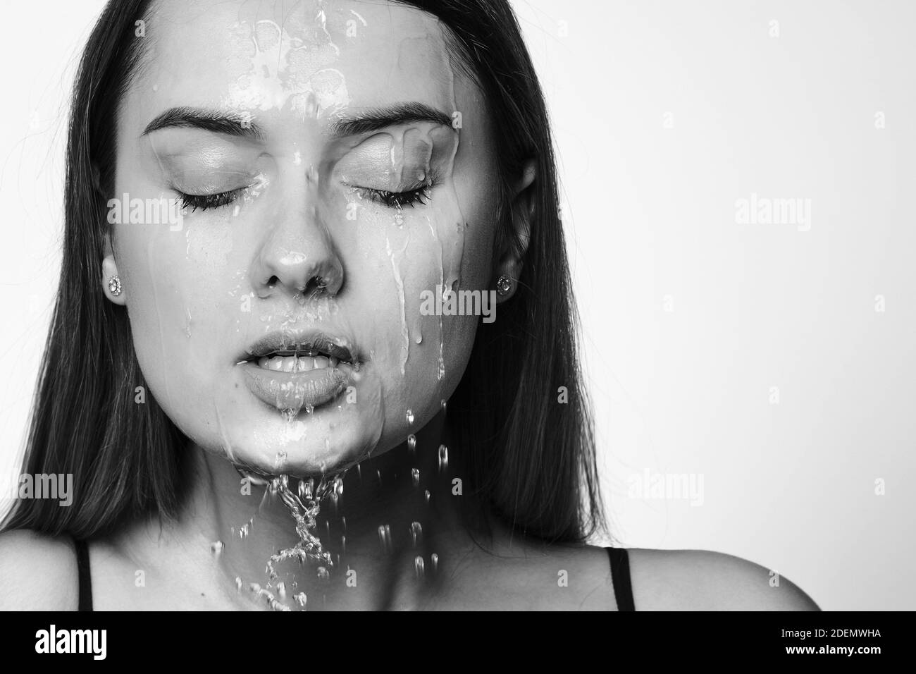 Wash your face, the freshness of clean water on the skin. Portrait of a young beautiful