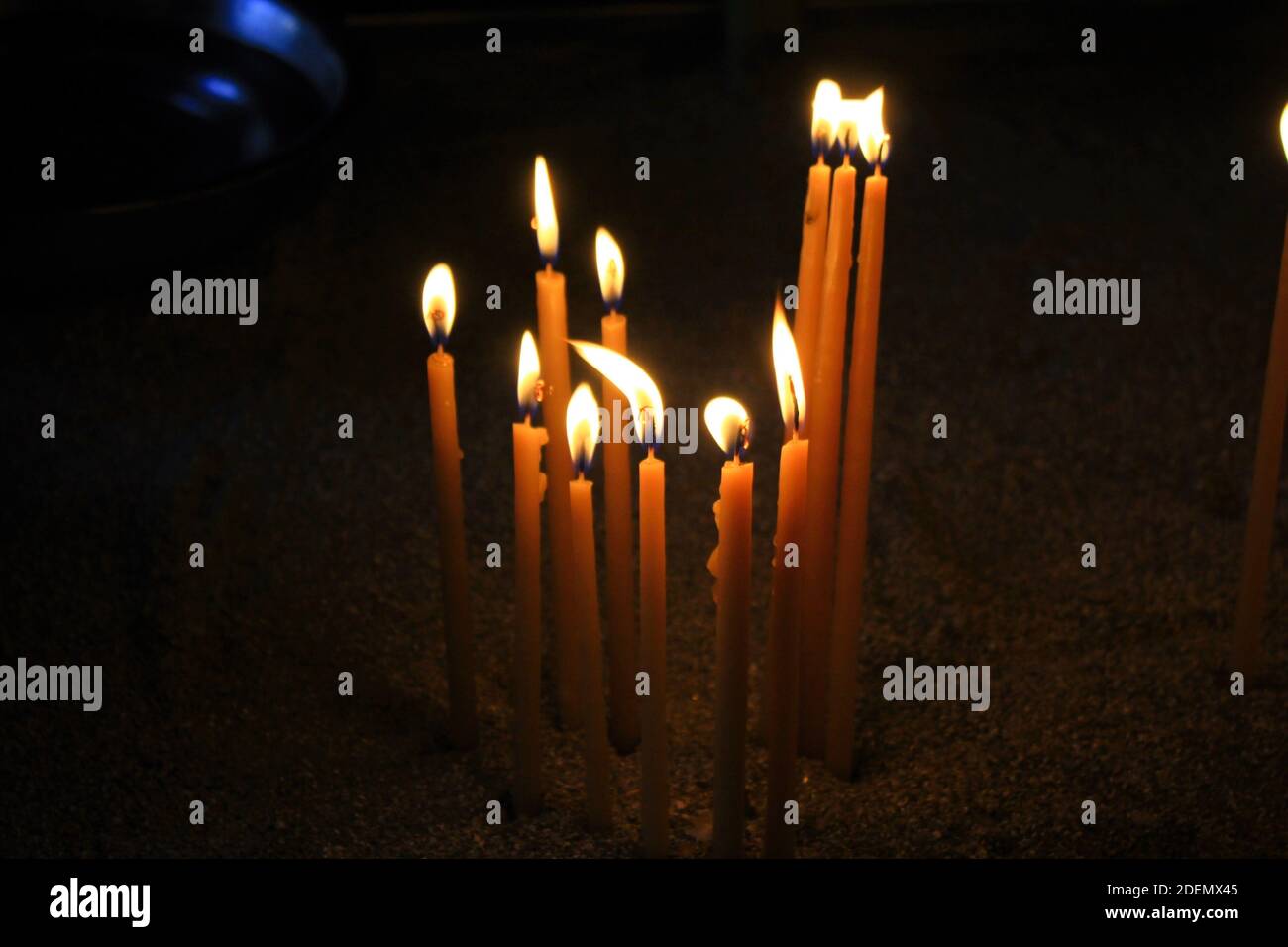 Lighting candles inside a Greek orthodox church Stock Photo - Alamy