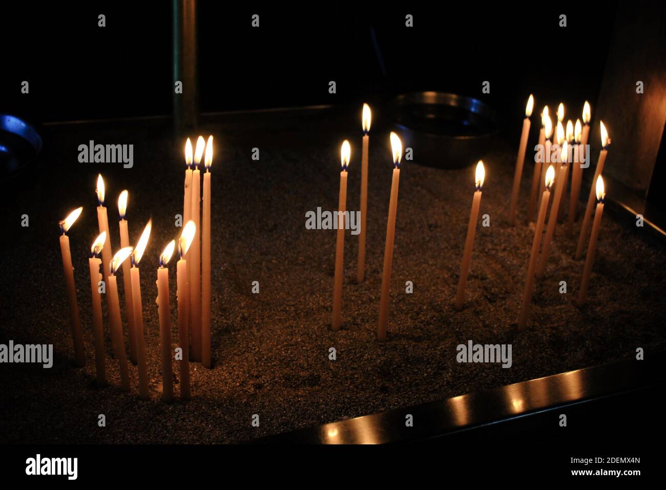 Lighting candles inside a Greek orthodox church Stock Photo - Alamy