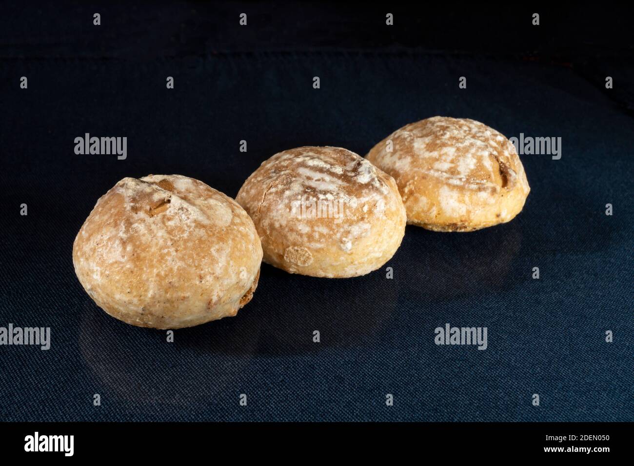 Home baking on turn blue the table with reflection. Sweet products of the feeding on black background Stock Photo