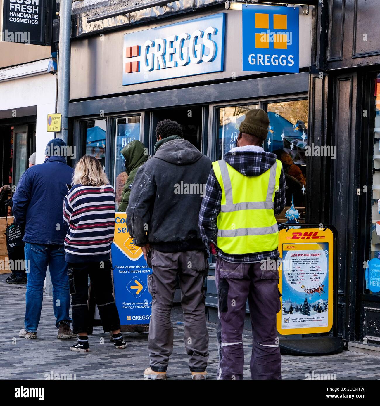 London UK, December 01 2020, Group Of People Customers Queuing Outside Greggs Bakery For Takeaway Food Stock Photo