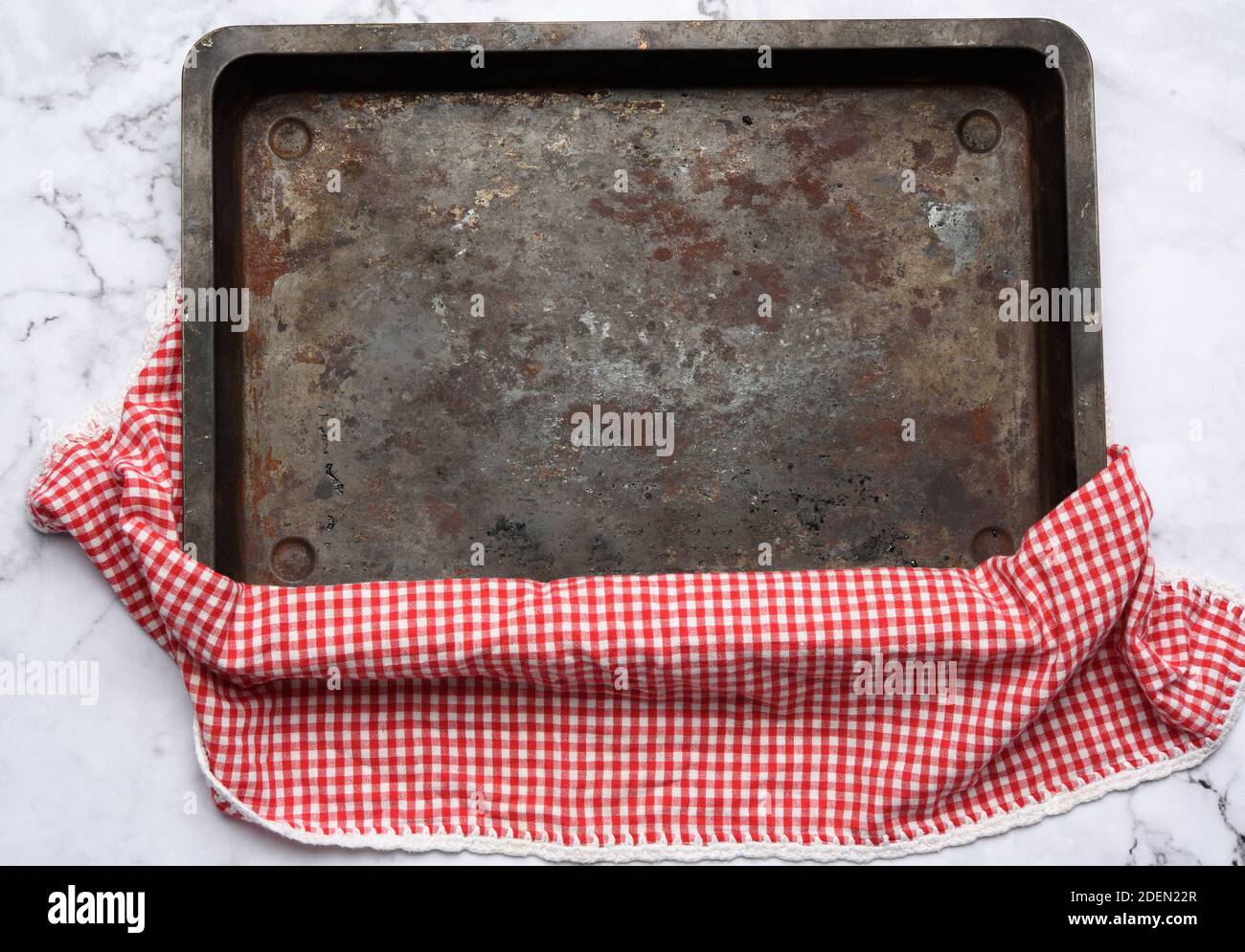 empty rectangular iron baking sheet on white marble table, top view Stock Photo