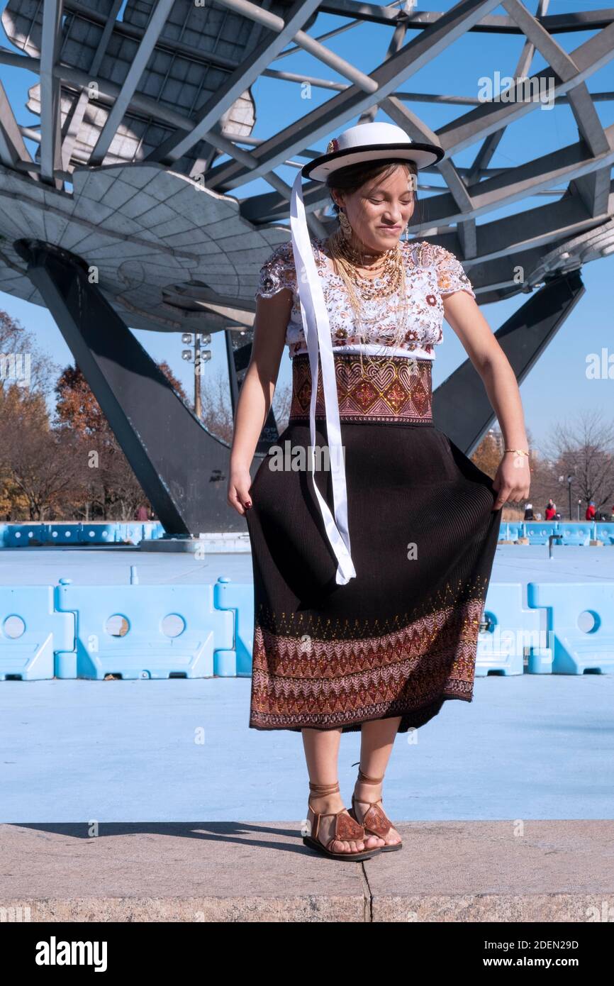 A young Ecuadorian dancer dances during the making of a video. At the Unisphere in Flushing Meadows, Corona Park in Queens, New York City. Stock Photo