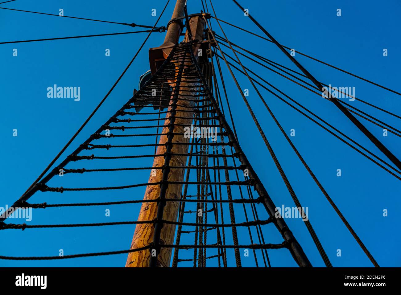 Rope ladder leading up the mast of an vintage wooden tall ship. . High quality photo Stock Photo
