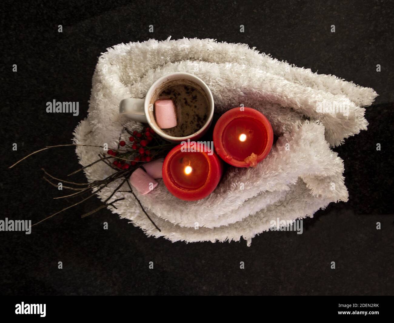 A winter inspired lay-flat, still life composition of white, red and pink Stock Photo