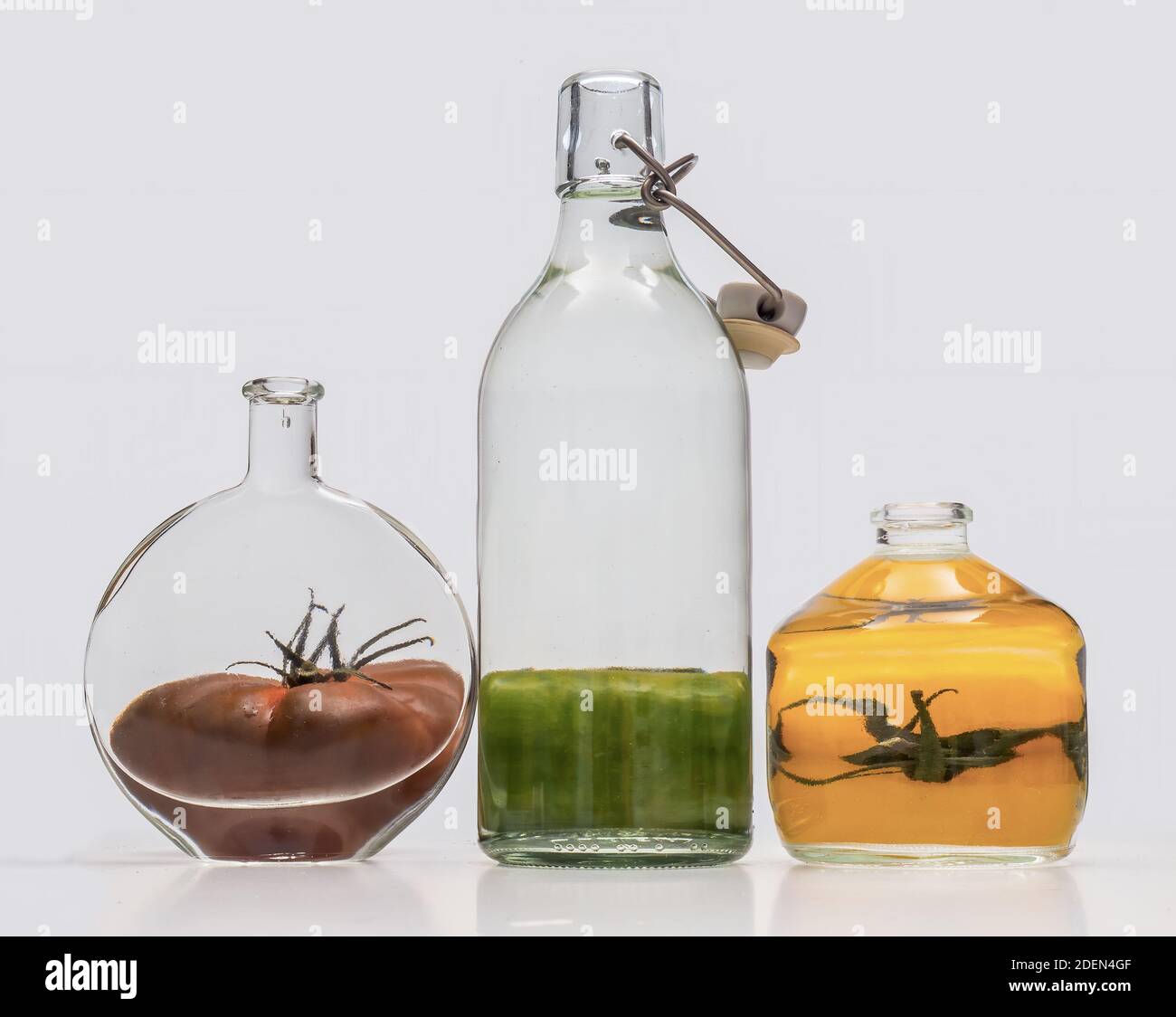 Tomatoes distorted through glass bottles of water refraction example