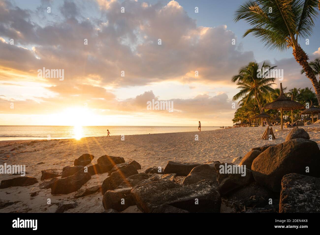 Mother and daughter on the beach at sunset, Flic en flac beach