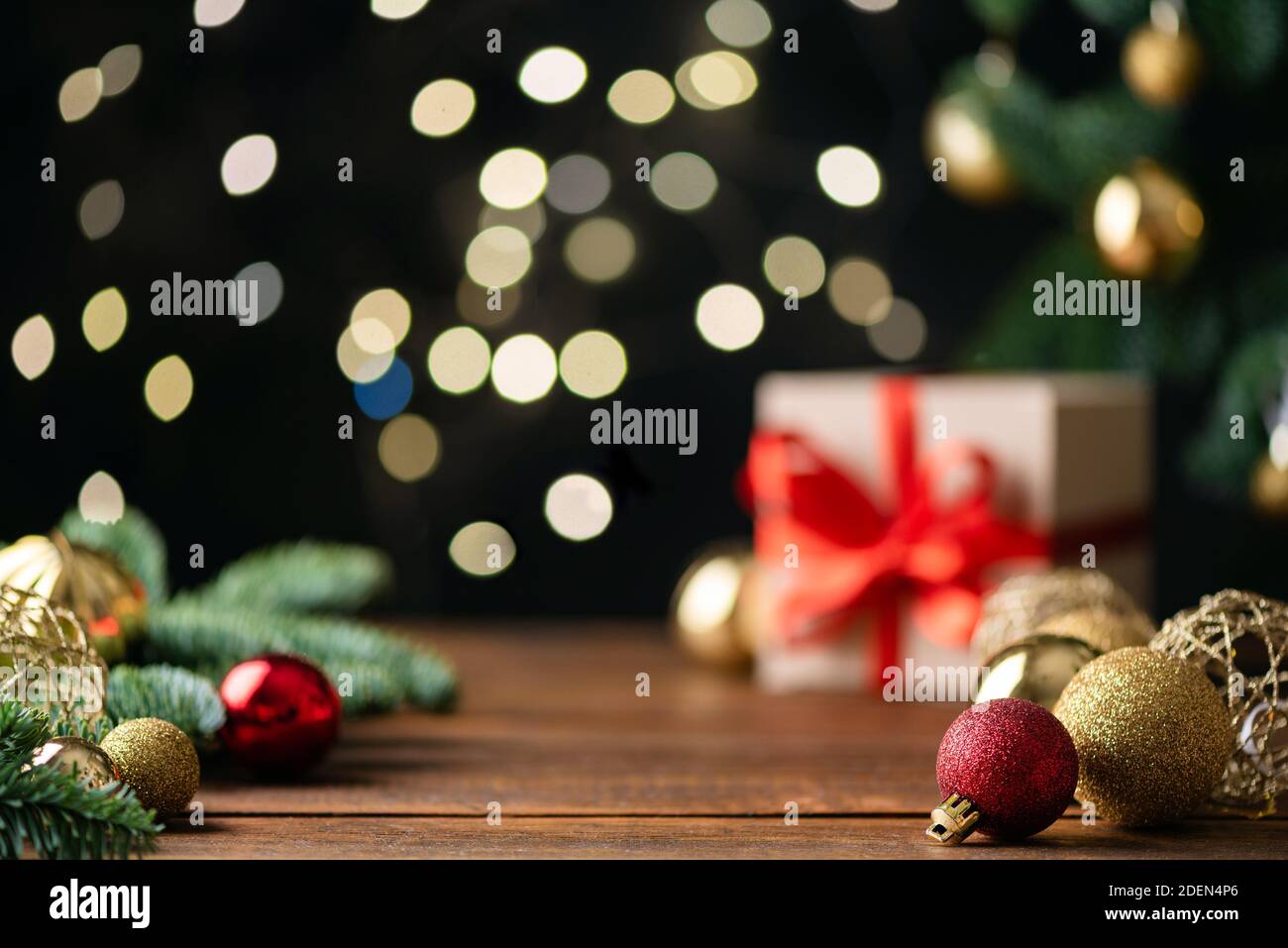 Christmas background with bokeh lights, presents and christmas tree. Copy space for text. Advent still life Stock Photo