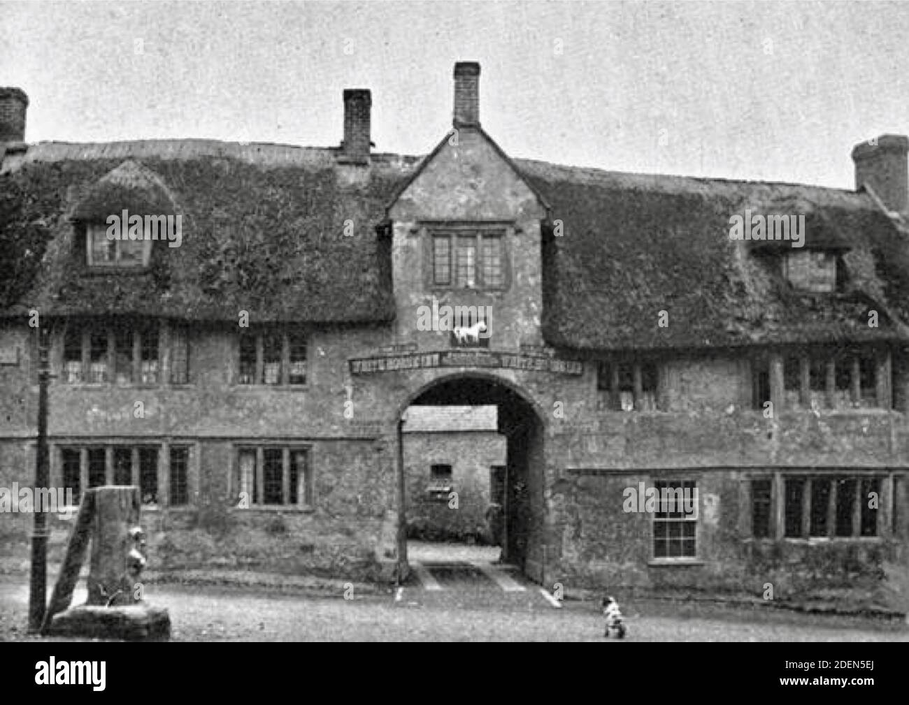 Old photograph of the White Horse in Maiden Newton, Dorset England. Now closed and residential accommodation. Stock Photo