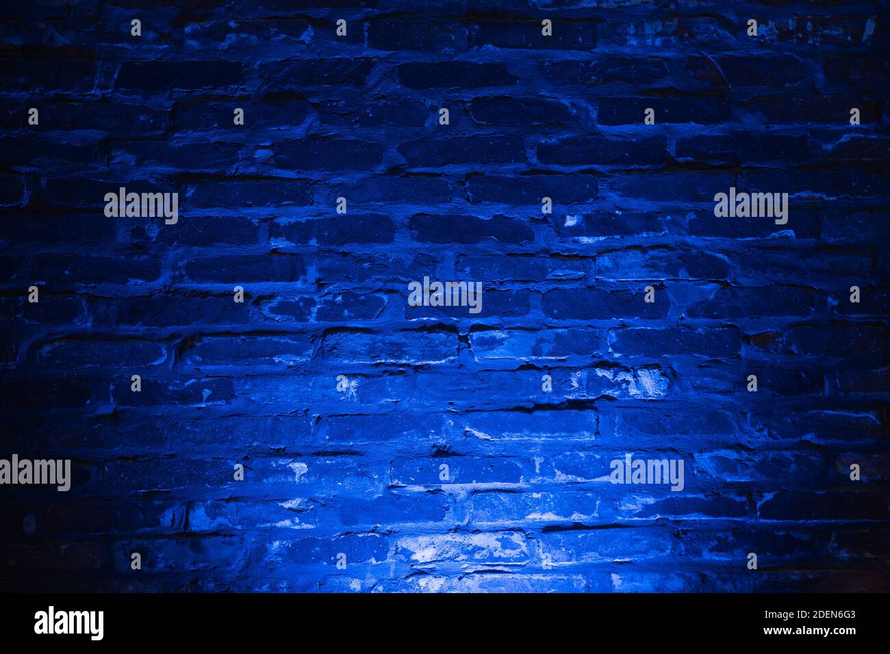 Empty brick wall with bright blue neon light background Stock Photo - Alamy