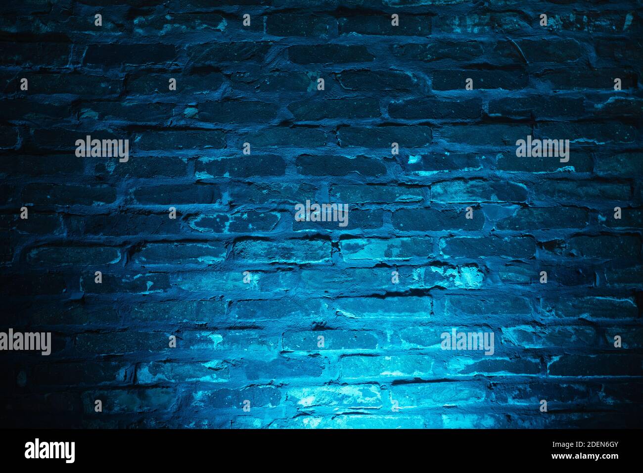 Empty brick wall with blue neon light background Stock Photo - Alamy
