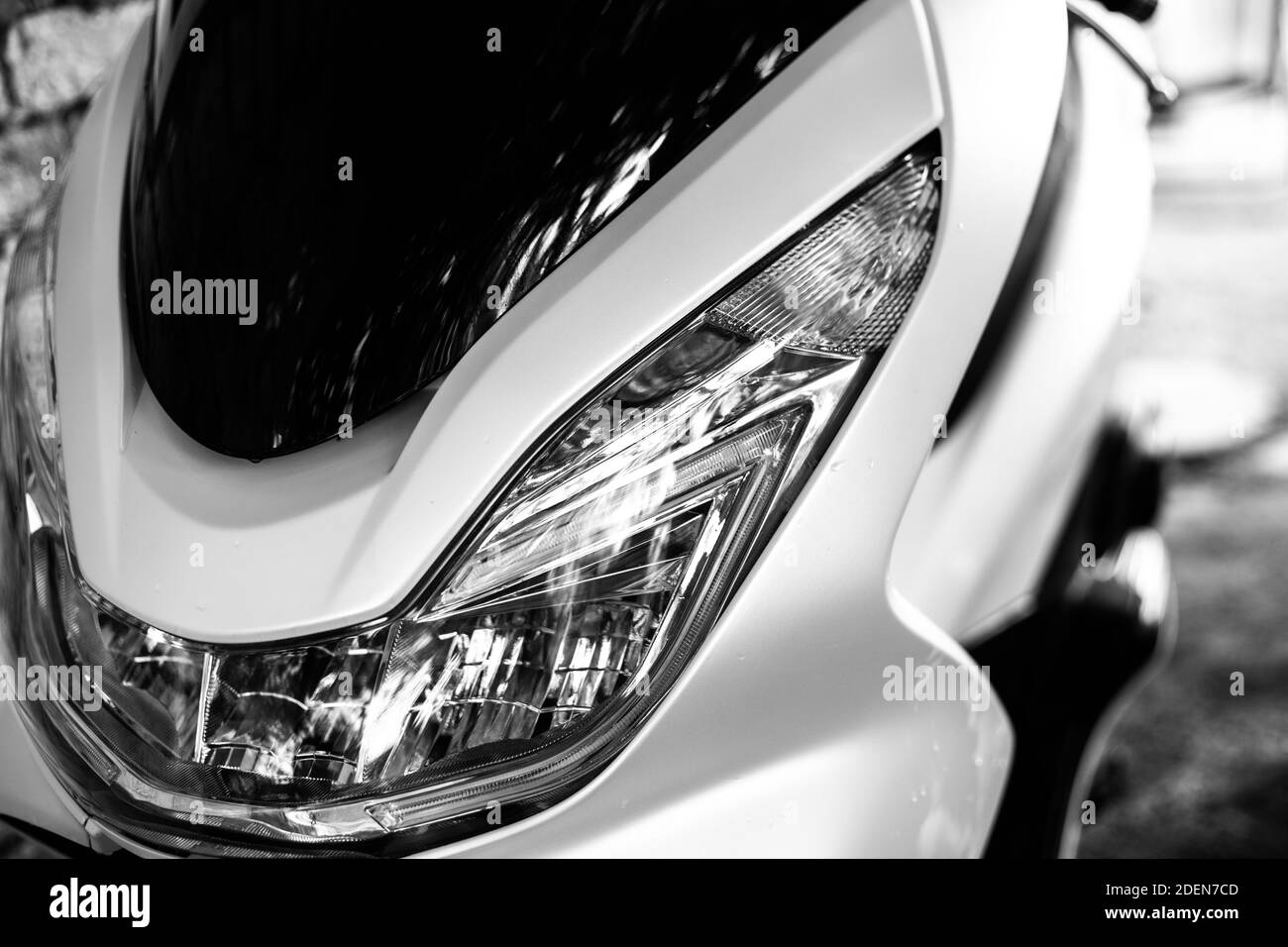 glass motorcycle headlight. Graceful lines. Front view.Black and white photo Stock Photo Alamy
