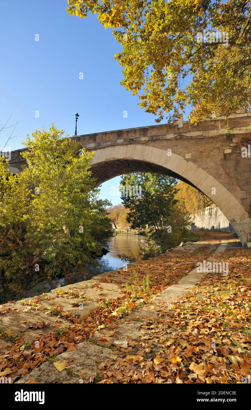Italy, Rome, Tiber river, riverbank and Pons Fabricius bridge in autumn Stock Photo