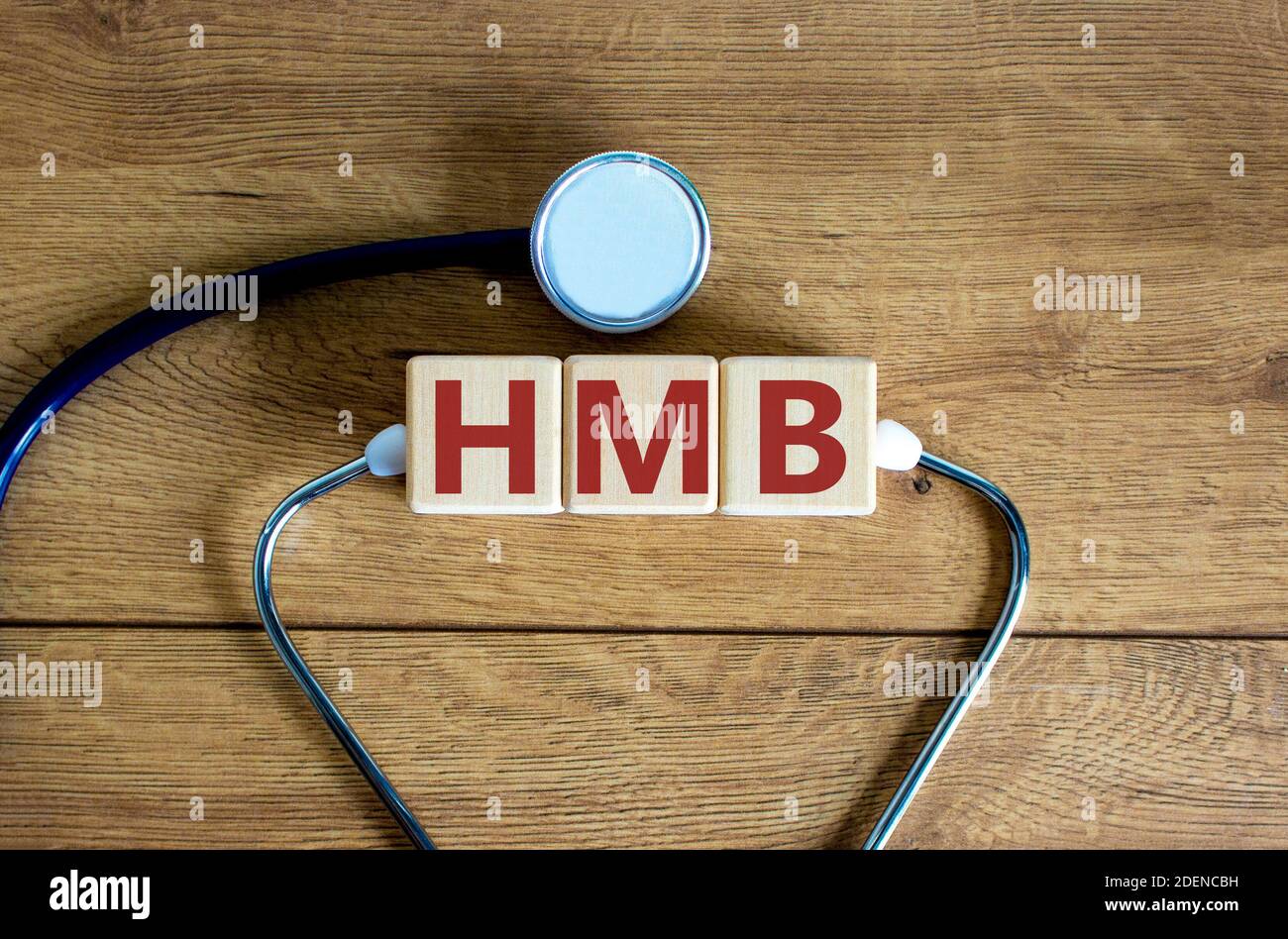 HMB symbol. Wooden cubes with the words 'HMB - heavy menstrual bleeding ...