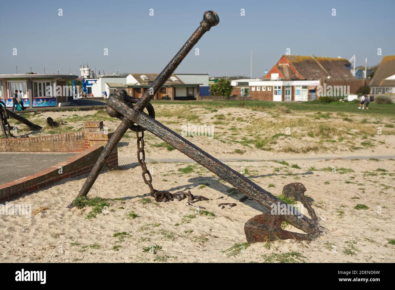 Half buried anchor on the beach at Littlehampton, West Sussex, England Stock Photo