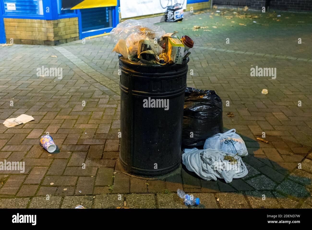 Overflow of rubbish from a bin in Lambeth, London, UK Stock Photo