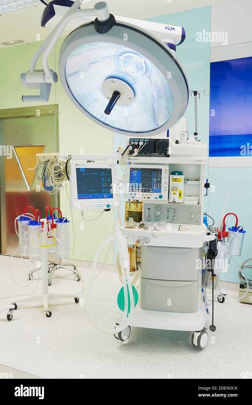 Hospital operating room, with overhead surgical lights, and may have