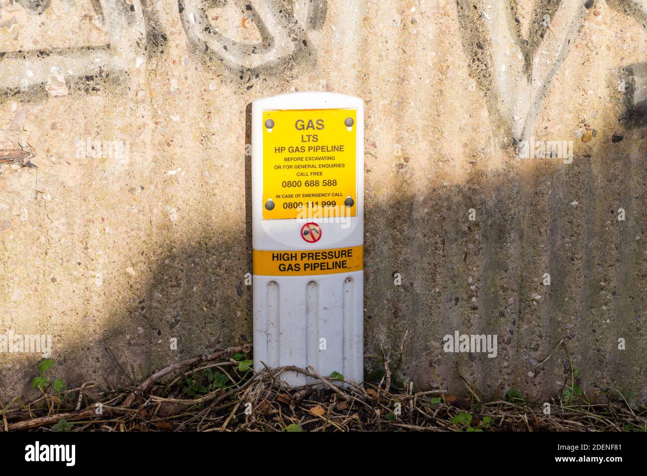 Sign warning of high pressure gas pipeline beside canal Stock Photo