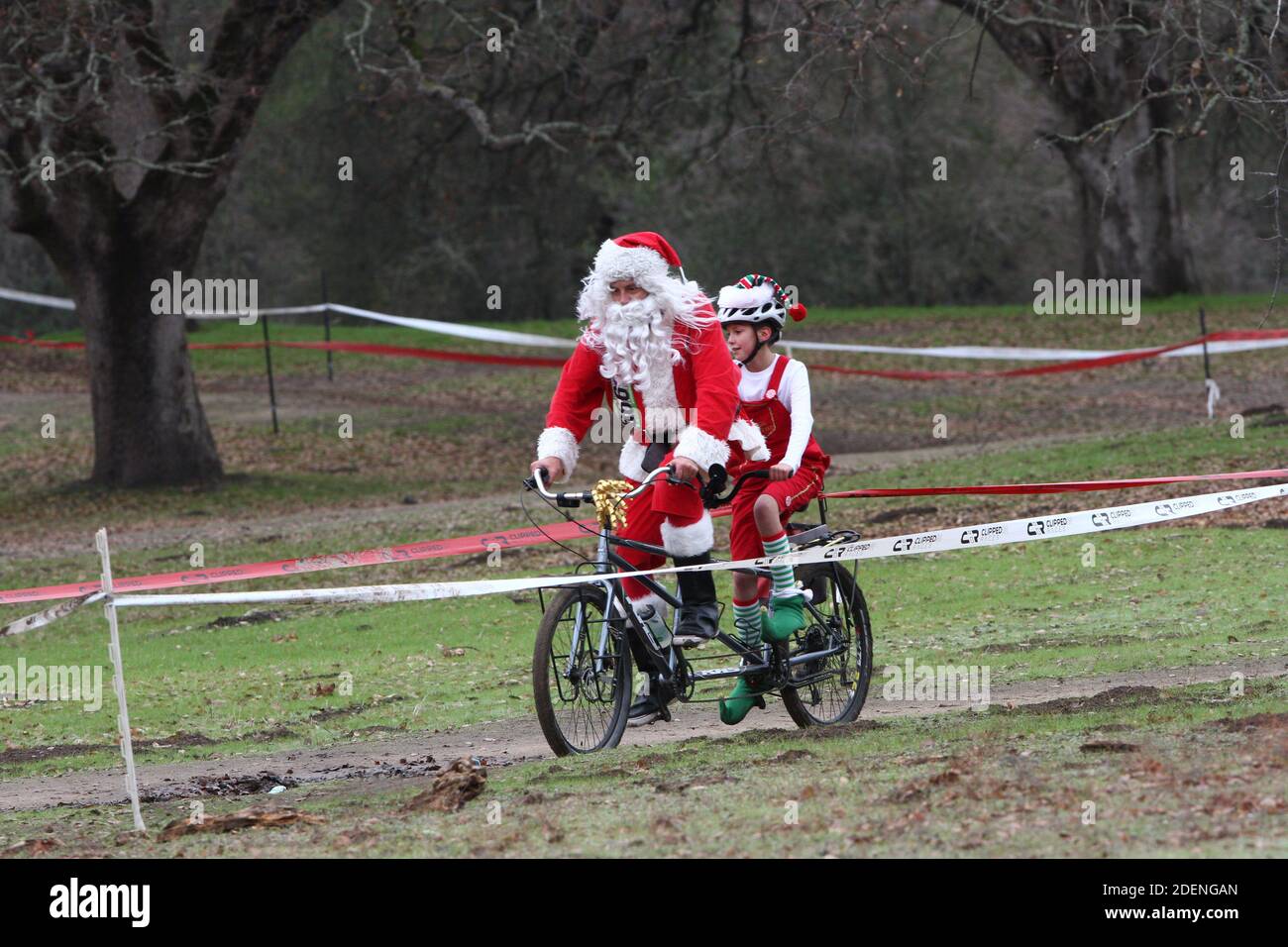 Santa claus delivering gifts bicycle hi-res stock photography and ...
