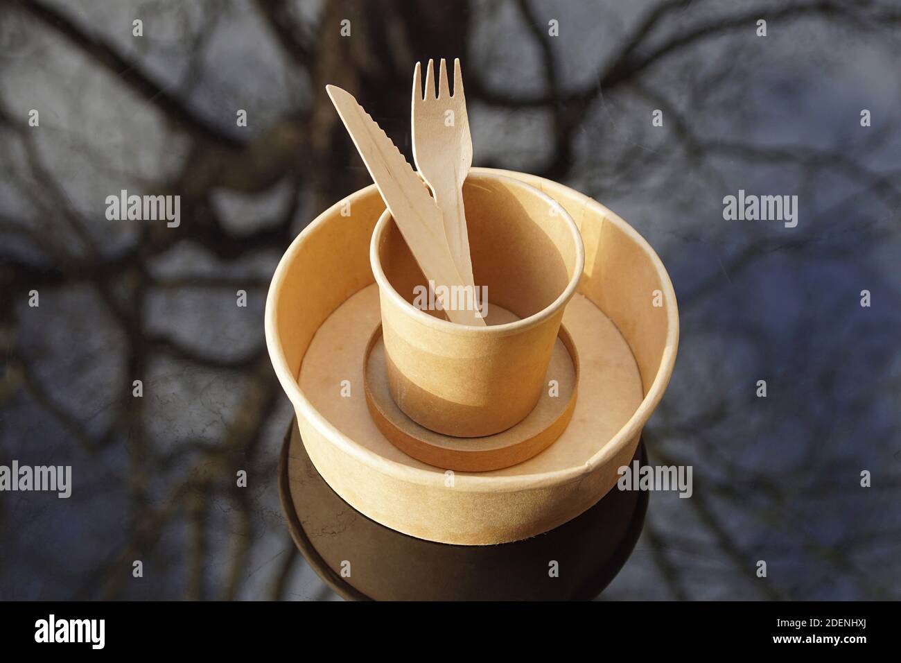 Paper plate and cup with wooden knife and fork from a takeaway ...
