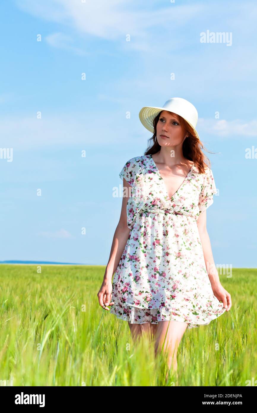 Pretty girl in a field Stock Photo - Alamy