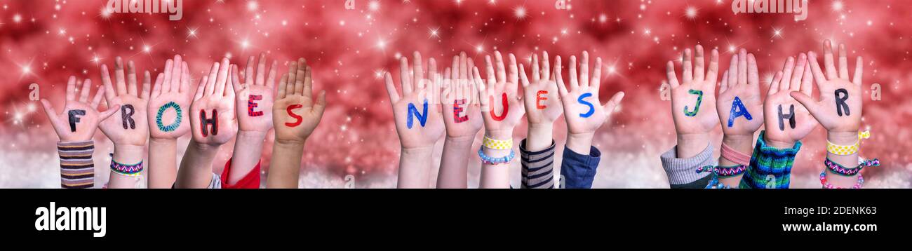 Children Hands Frohes Neues Means Happy New Year, Red Christmas Background Stock Photo