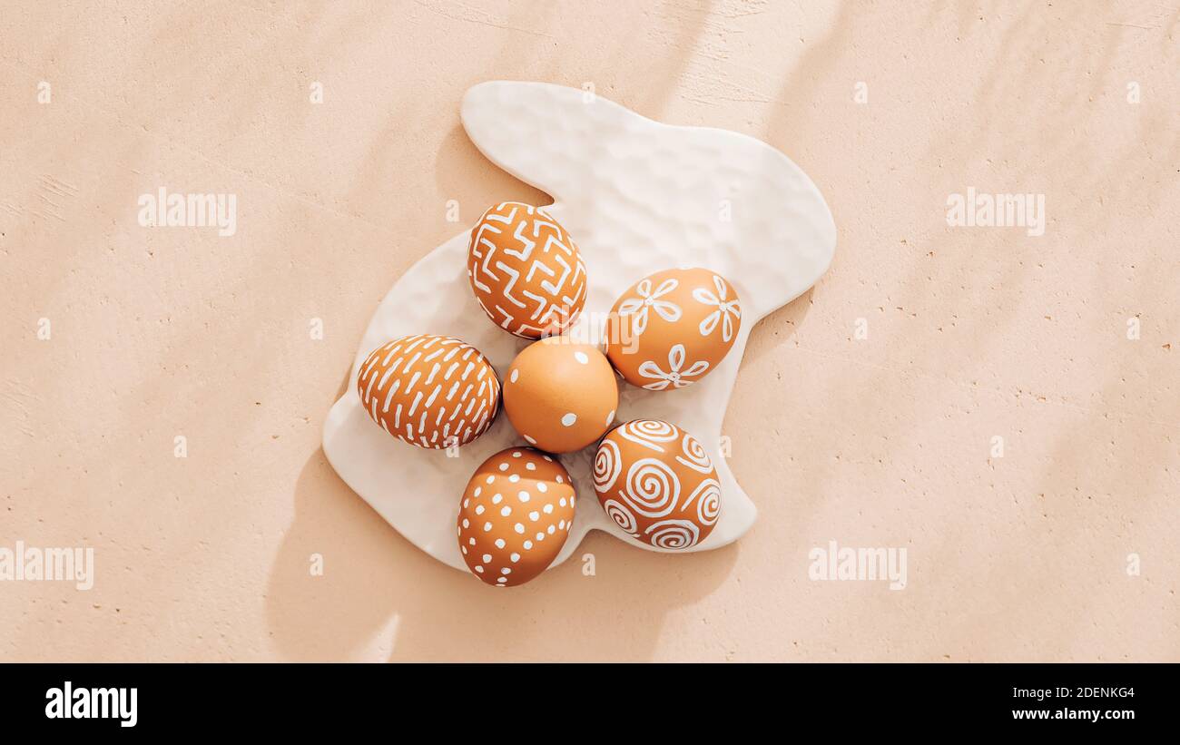 Monochrome minimalist Easter composition in spring warm pastel tones Stock Photo