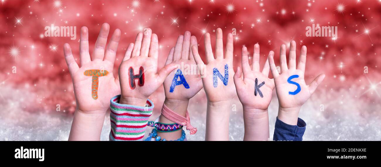 Children Hands Building Word Thanks, Red Christmas Background Stock Photo