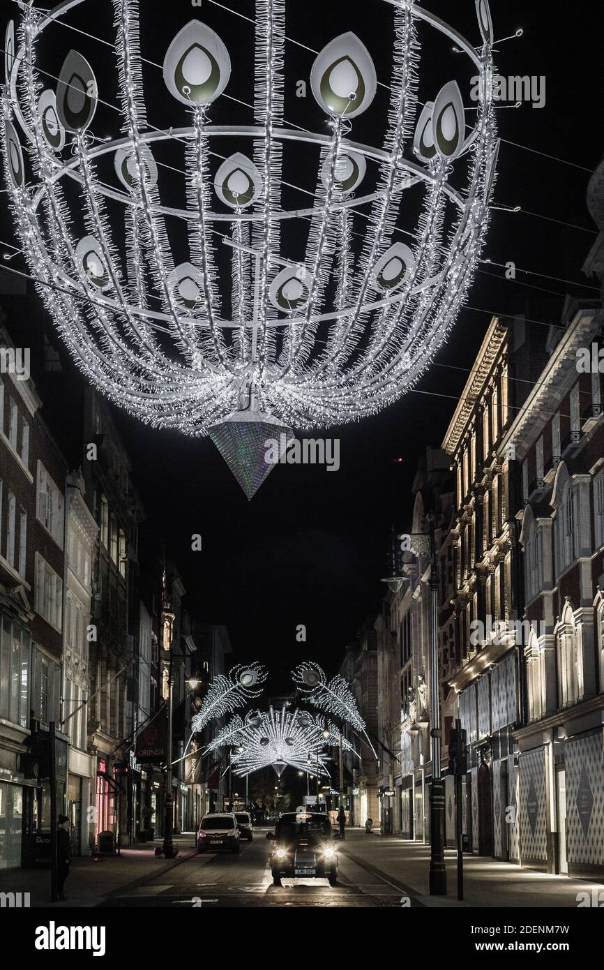 Peacock feathers illuminated as christmas lights on Bond Street in London Stock Photo Alamy