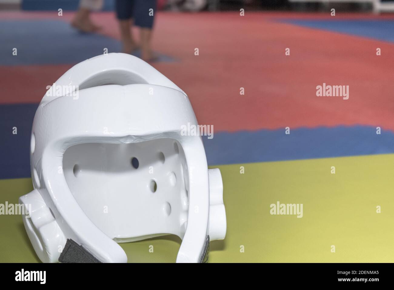 Safety helmet boxing and martial arts training. Helmet front view with training room background